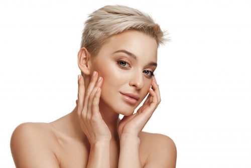 The beautiful female face. The perfect and clean skin of face on white. The beauty, care, skin, treatment, health, spa, cosmetic concept